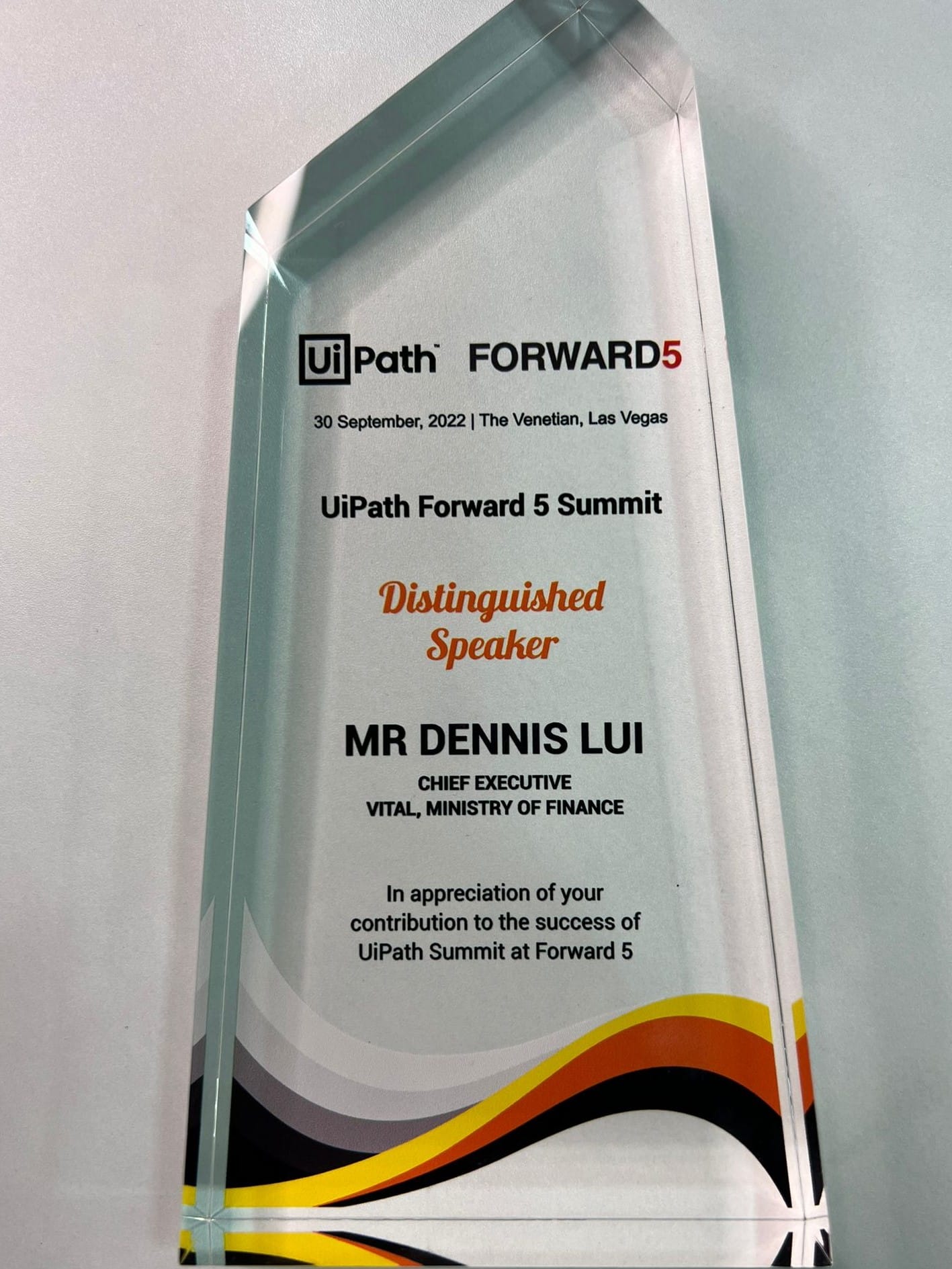 Glass award for Mr Dennis Lui, Distinguished Speaker at UiPath Forward 5 Summit, Las Vegas, September 2022.